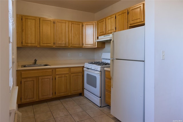 kitchen featuring white appliances, sink, light tile patterned floors, and tasteful backsplash