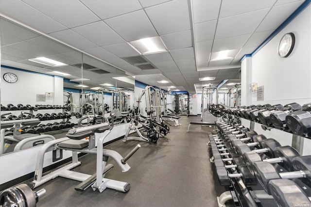 gym featuring a paneled ceiling