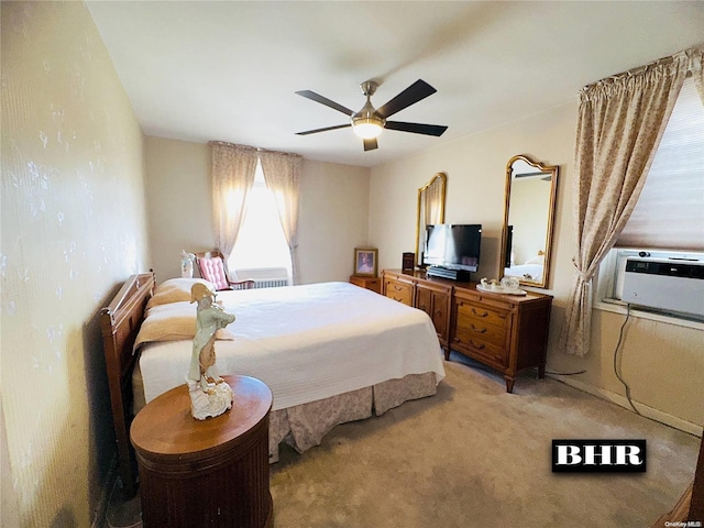 carpeted bedroom with a wall mounted air conditioner and ceiling fan