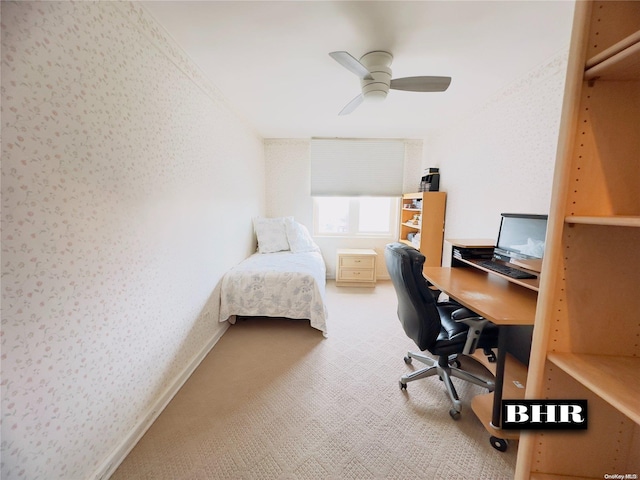 carpeted home office with ceiling fan