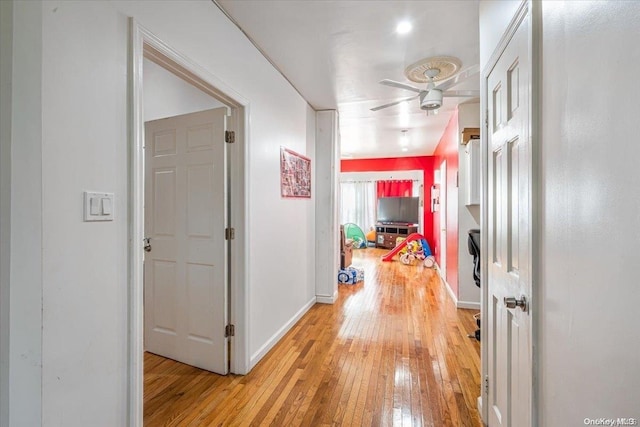 hall with light hardwood / wood-style floors