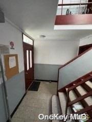 view of carpeted foyer