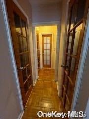 hallway with parquet flooring