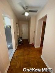 hall with dark parquet flooring