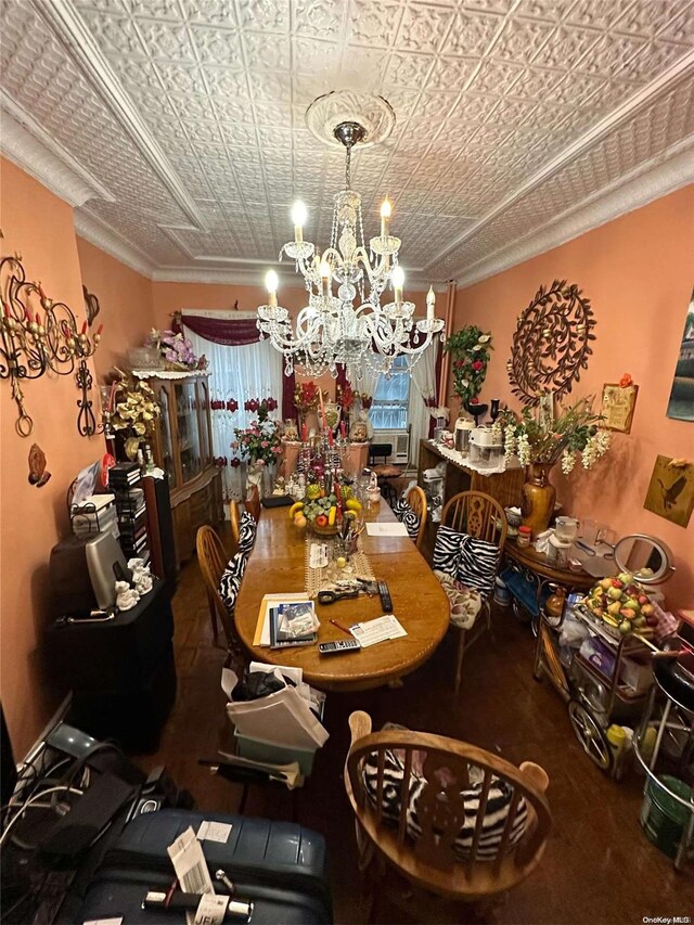 229 Nichols Ave, Brooklyn, NY 11208 - dining space featuring a chandelier, an ornate ceiling, and ornamental molding