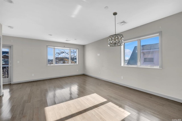 interior space featuring a chandelier and hardwood / wood-style flooring