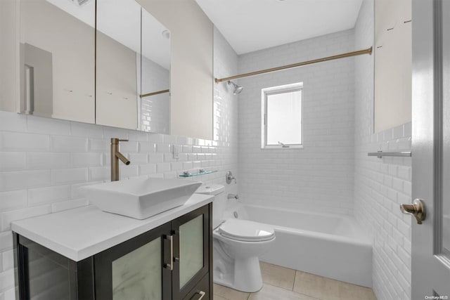 full bathroom featuring tile patterned flooring, decorative backsplash, vanity, and tile walls