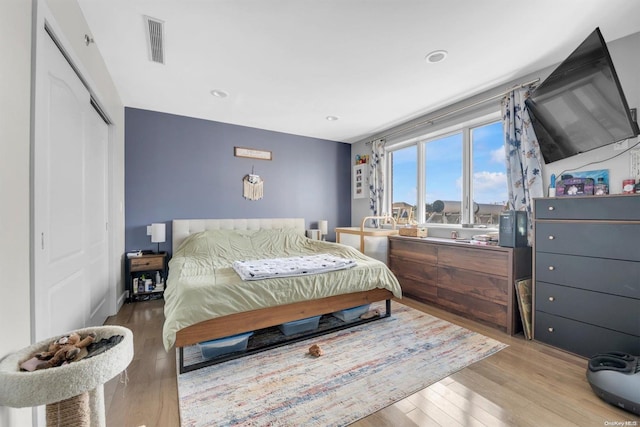 bedroom featuring a closet and hardwood / wood-style flooring