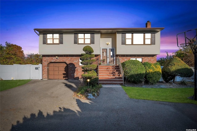 raised ranch featuring a garage