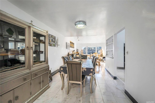 dining area featuring baseboard heating