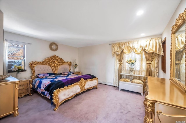 carpeted bedroom with a baseboard radiator