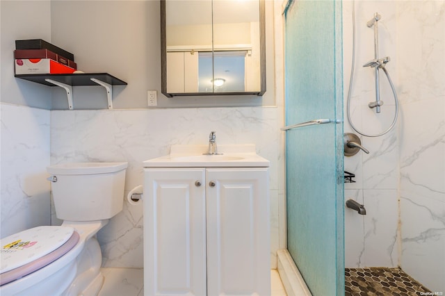 bathroom featuring toilet, vanity, tile walls, and walk in shower