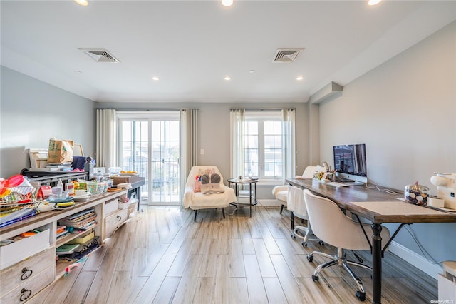 office area with light hardwood / wood-style flooring