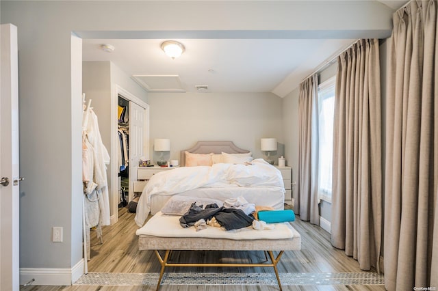 bedroom featuring light hardwood / wood-style flooring and a closet