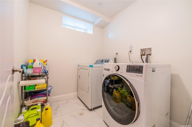 laundry room with washer and clothes dryer