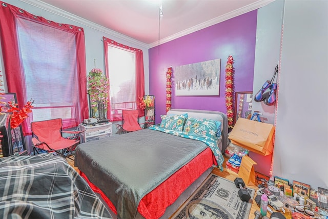 bedroom with wood-type flooring and ornamental molding