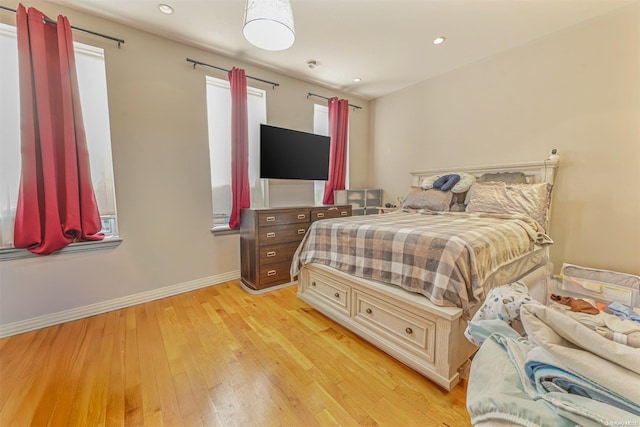 bedroom with light hardwood / wood-style flooring