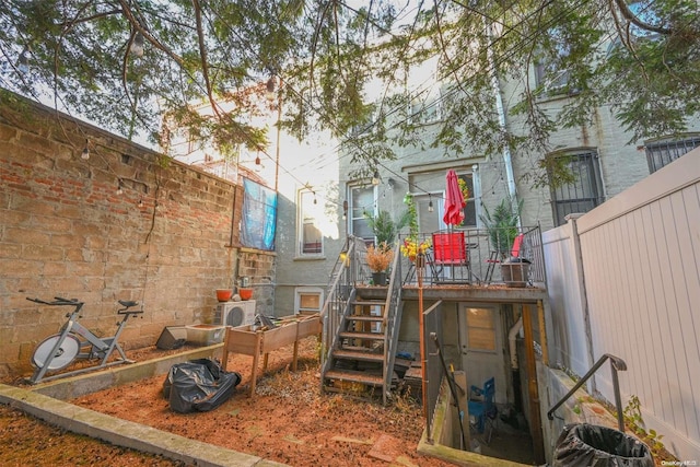 rear view of property featuring ac unit