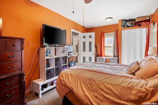 carpeted bedroom featuring ceiling fan