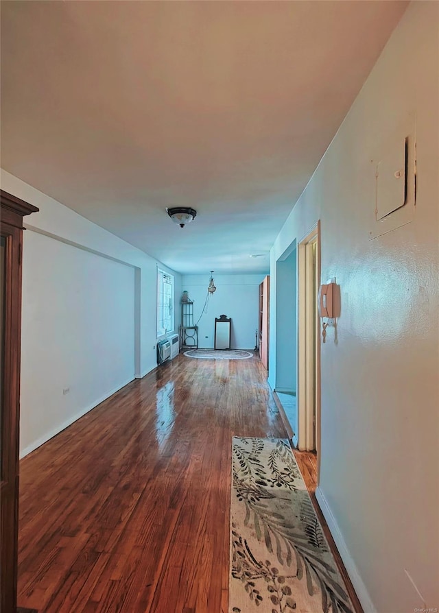 interior space featuring hardwood / wood-style flooring and a wall unit AC