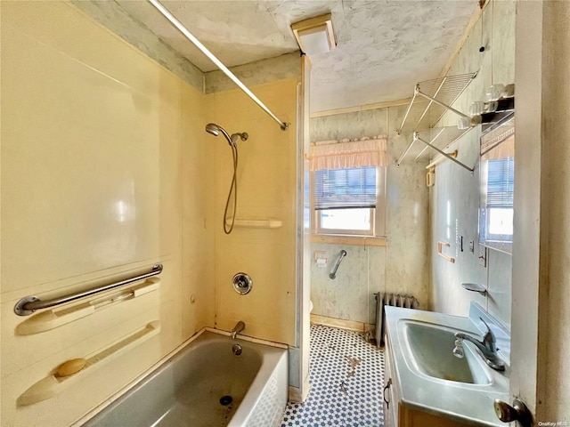 full bathroom with radiator, vanity, shower / tub combination, tile patterned flooring, and toilet