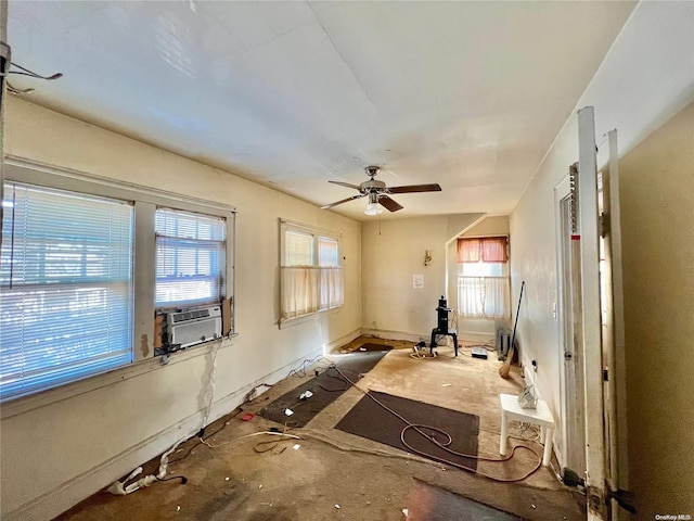 workout room with ceiling fan and cooling unit