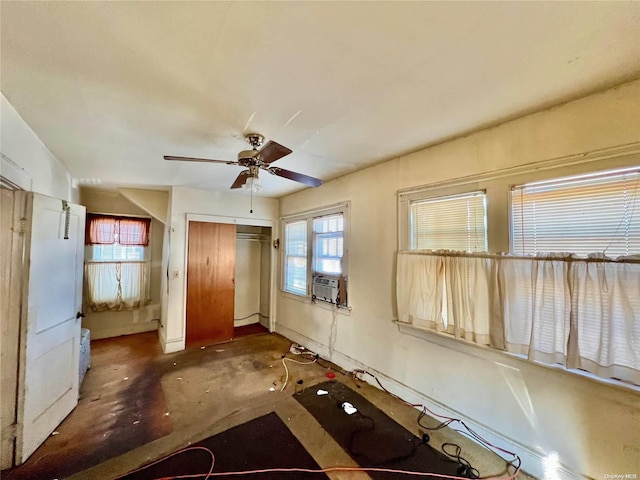 interior space with ceiling fan, a closet, and cooling unit