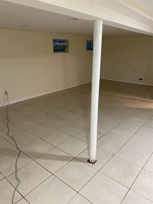 basement featuring light tile patterned flooring