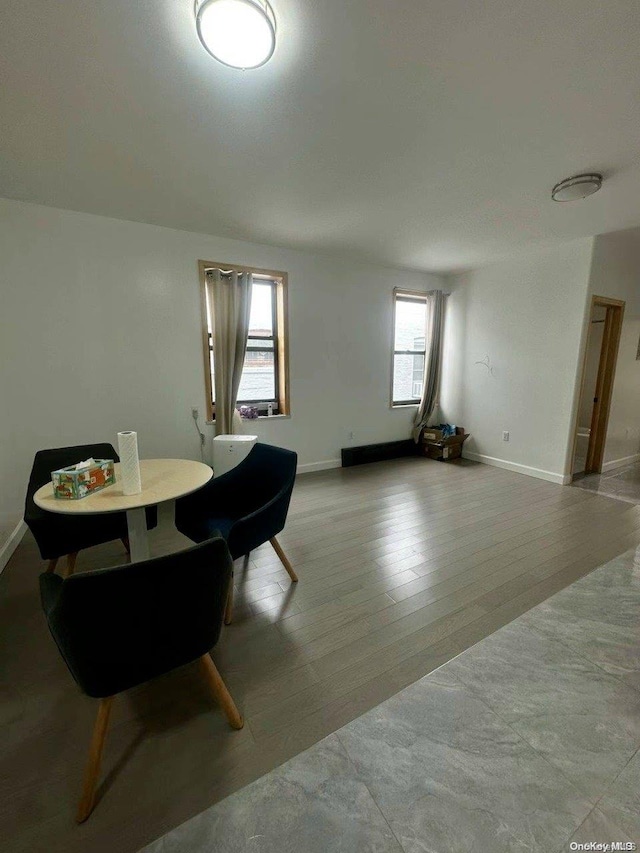 dining space with a wealth of natural light and light wood-type flooring