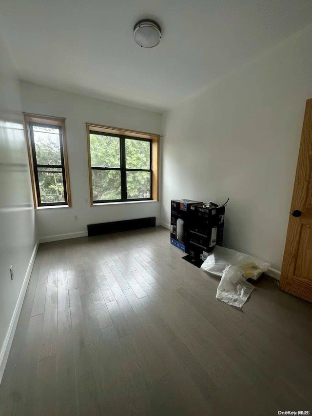 spare room with light wood-type flooring