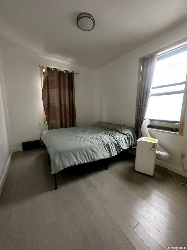 bedroom featuring hardwood / wood-style flooring