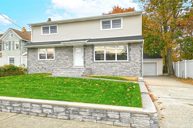 front facade with a front lawn, an outdoor structure, and a garage