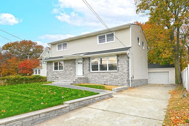 front of property featuring a front lawn, an outdoor structure, and a garage