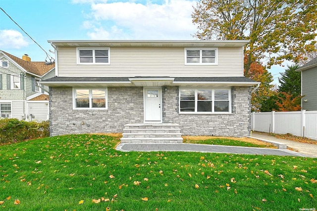 front facade featuring a front lawn