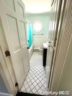 full bathroom with shower / bath combination with curtain, vanity, toilet, and tile patterned floors