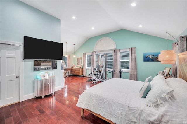 bedroom with wood-type flooring and vaulted ceiling