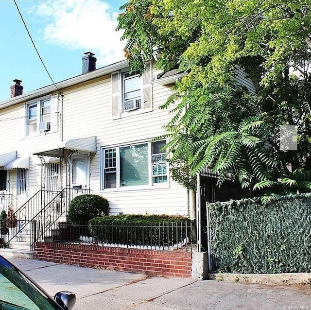 view of front of property with cooling unit