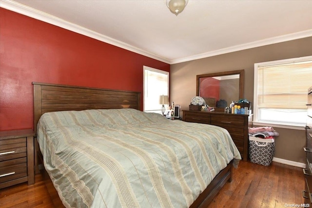 bedroom with dark hardwood / wood-style floors and ornamental molding