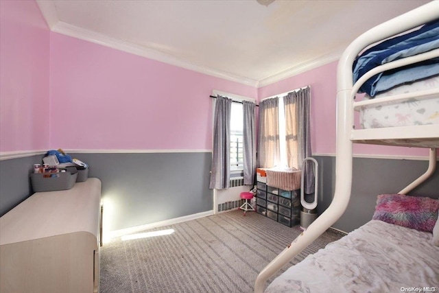 bedroom with radiator heating unit, carpet, and ornamental molding