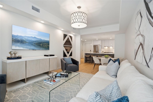 living room with light hardwood / wood-style flooring