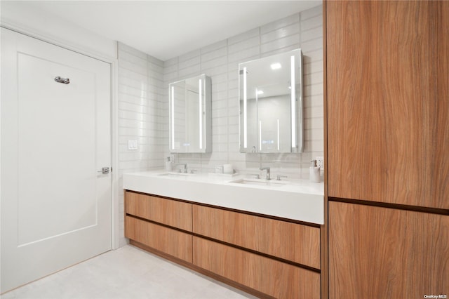 218 Middle Neck Rd Unit 301, Great Neck, NY 11021 - full bathroom featuring double vanity, tile walls, and backsplash