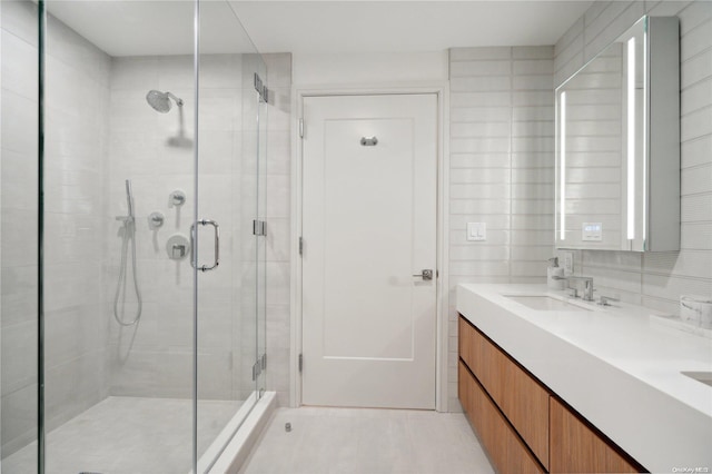 218 Middle Neck Rd Unit 301, Great Neck, NY 11021 - bathroom featuring a stall shower and double vanity