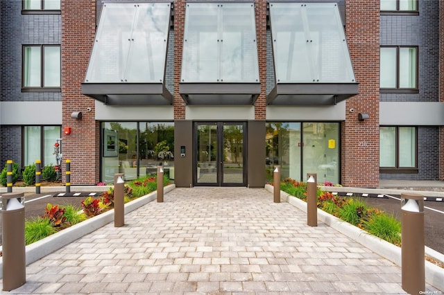 218 Middle Neck Rd Unit 301, Great Neck, NY 11021 - view of exterior entry featuring french doors and brick siding