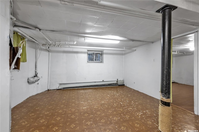 basement with a baseboard heating unit