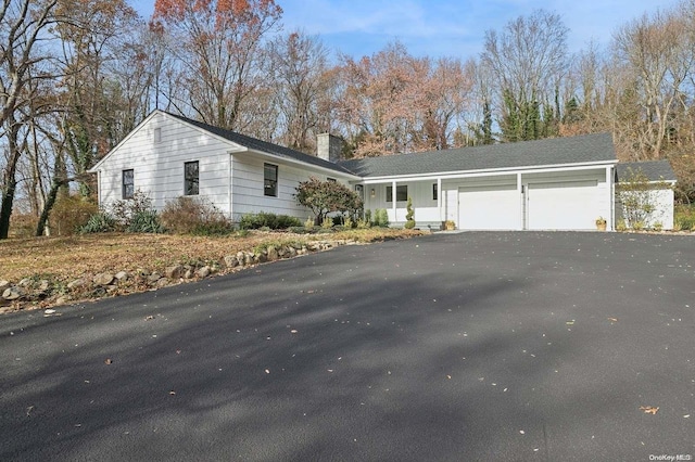 ranch-style home with a garage