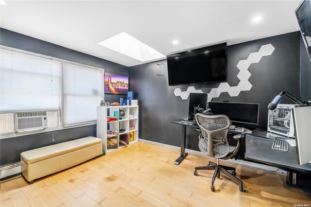 office space featuring a skylight and wood-type flooring