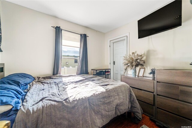 bedroom featuring dark hardwood / wood-style floors