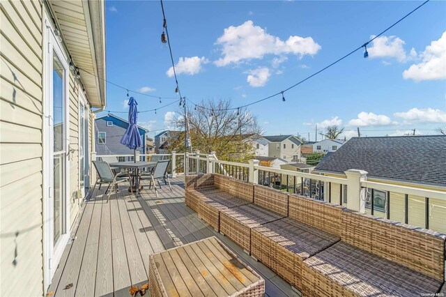 wooden terrace with outdoor lounge area