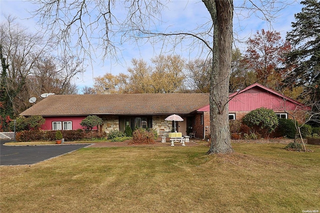 ranch-style house with a front lawn