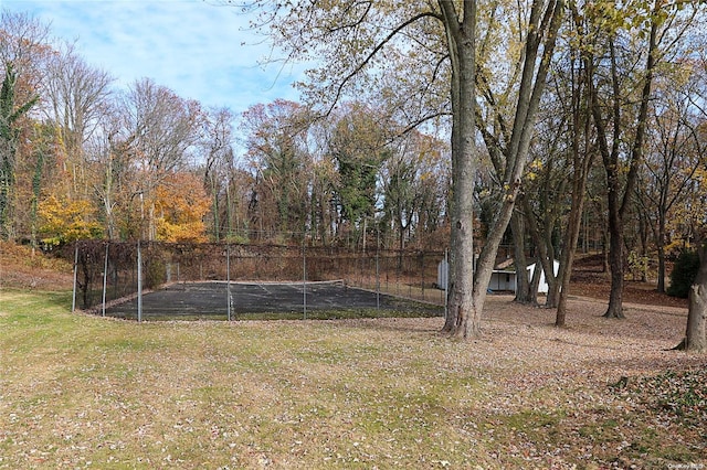 view of yard featuring tennis court